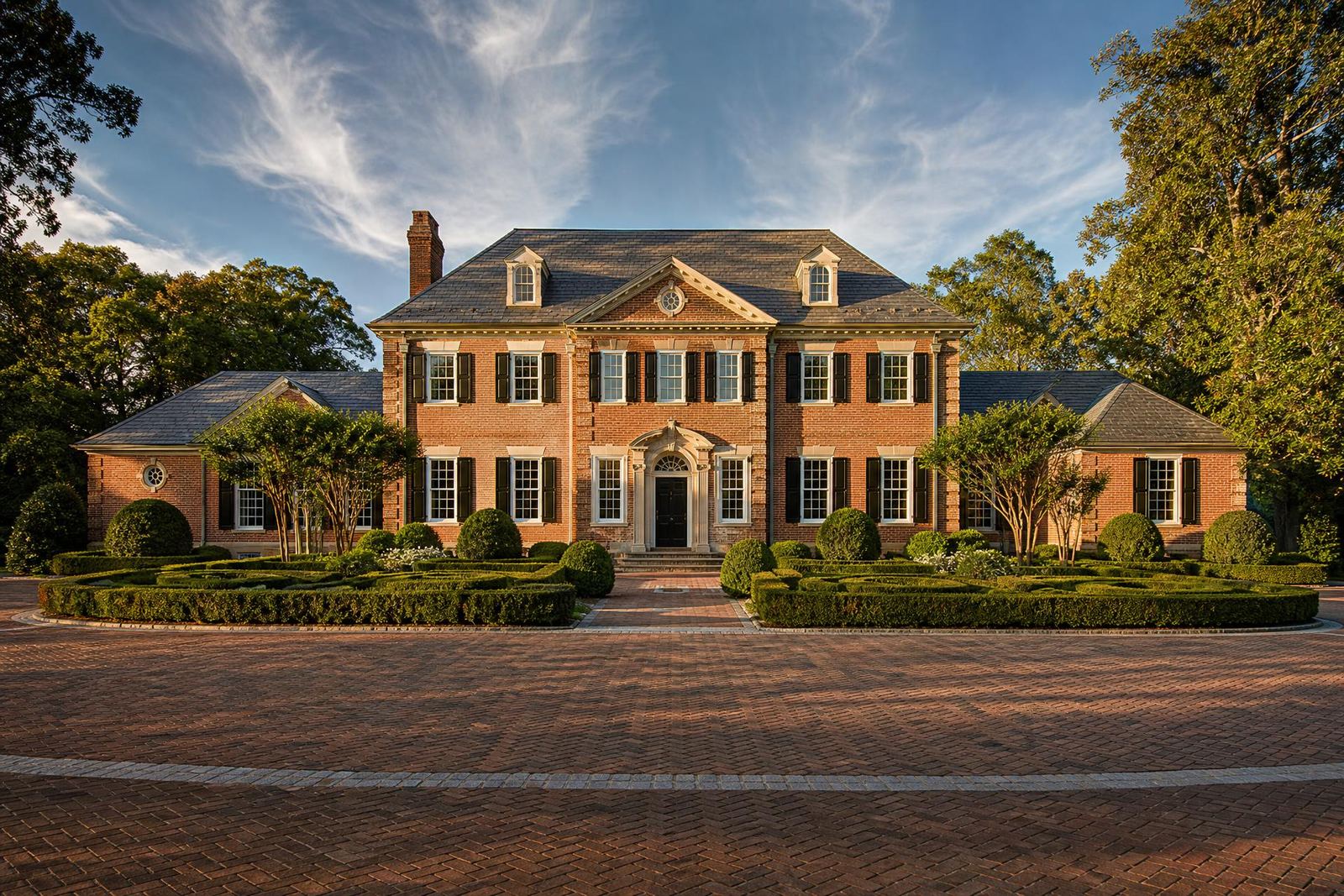 A grand European-style estate in Morrocroft, Charlotte at golden hour